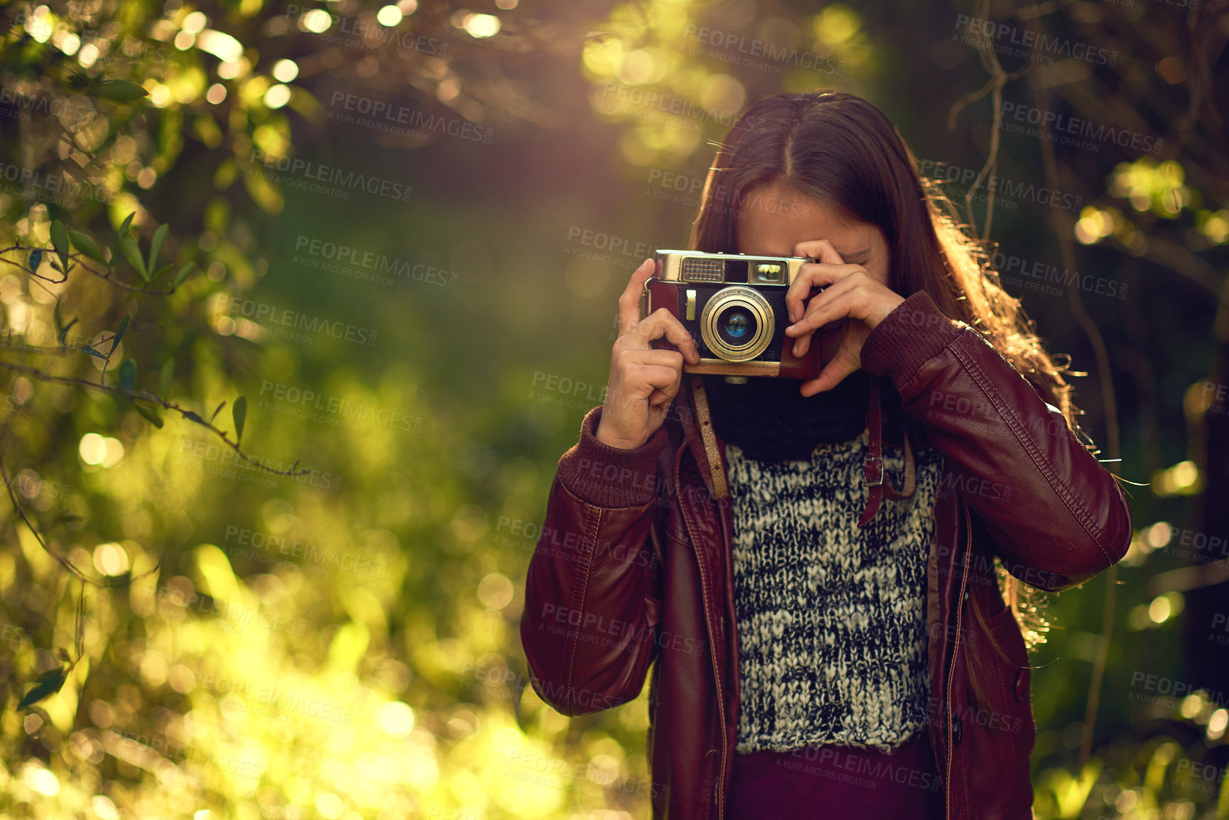 Buy stock photo Vintage camera, nature and girl in park, photography and memory with picture, weekend break and adventure. Outdoor, photographer or explore for journey, hobby or activity in forest, sunshine or retro