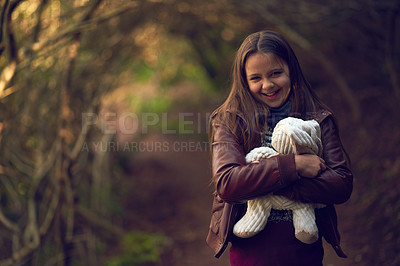 Buy stock photo Happy, child and portrait with teddy bear in forest for nature exploration, adventure and journey. Little girl, smile and relax with stuffed animal in woods for weekend, holiday and fun in Australia