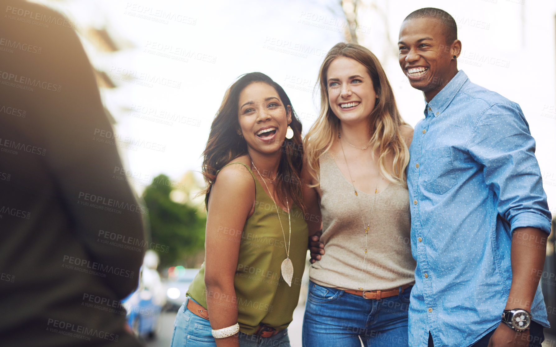Buy stock photo Shot of a group of young friends having their picture taken outdoors