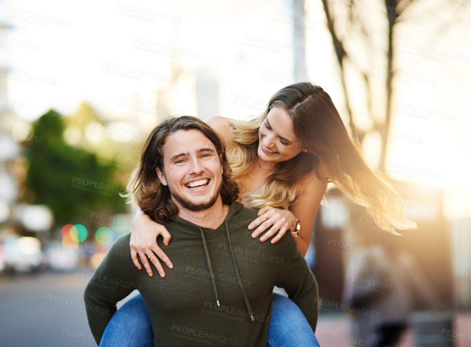 Buy stock photo Piggyback, portrait or happy couple laughing in city to travel for relationship, love or tourism. Smile, outdoor and excited people in urban town street for vacation adventure or holiday in Sweden