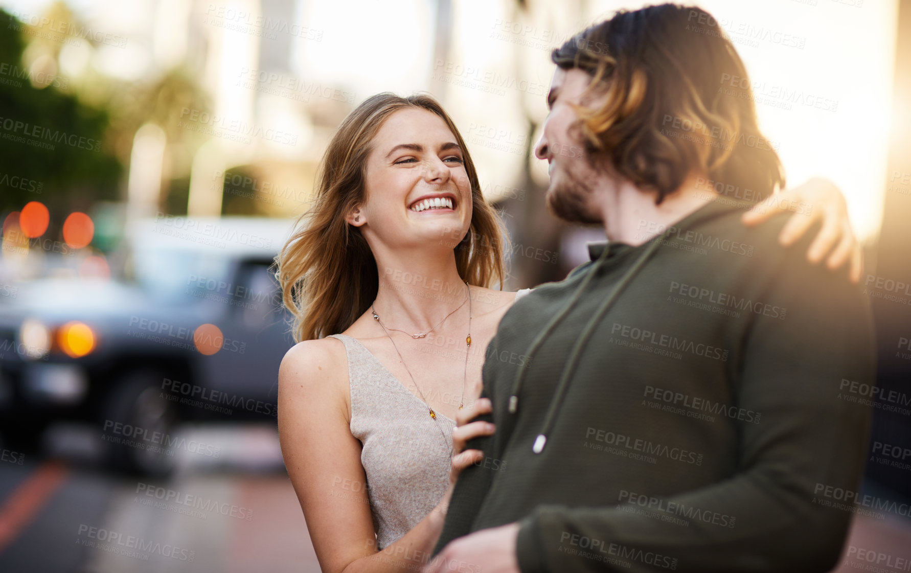 Buy stock photo Shot of a happy young couple out in the city together
