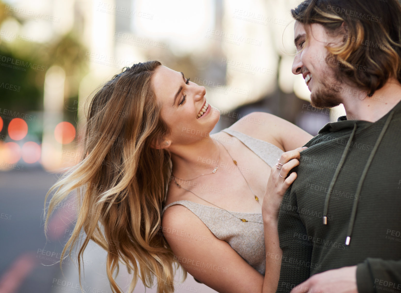 Buy stock photo Couple, trust and happy in city with smile for love, commitment and loyalty as partner. Man, woman and walking together in urban street for relationship, date and romance with joke or happiness
