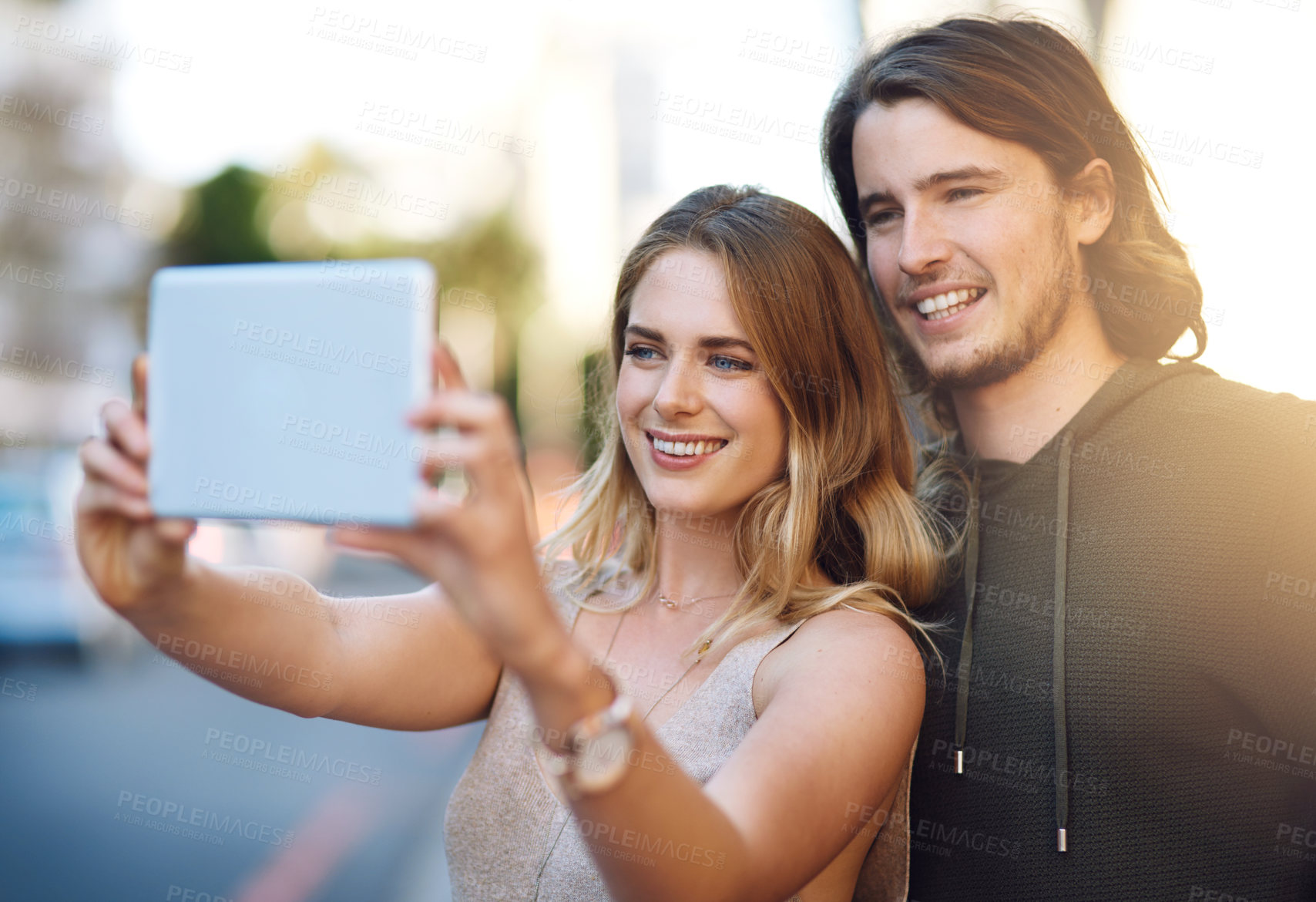 Buy stock photo Happy couple, memory and selfie with tablet in city for photography or picture together. Young, man or woman with smile or technology in relax for moment, capture or relationship in an urban town