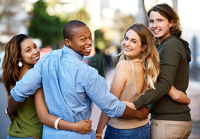 Buy stock photo Portrait of a group of friends taking a walk through the city together
