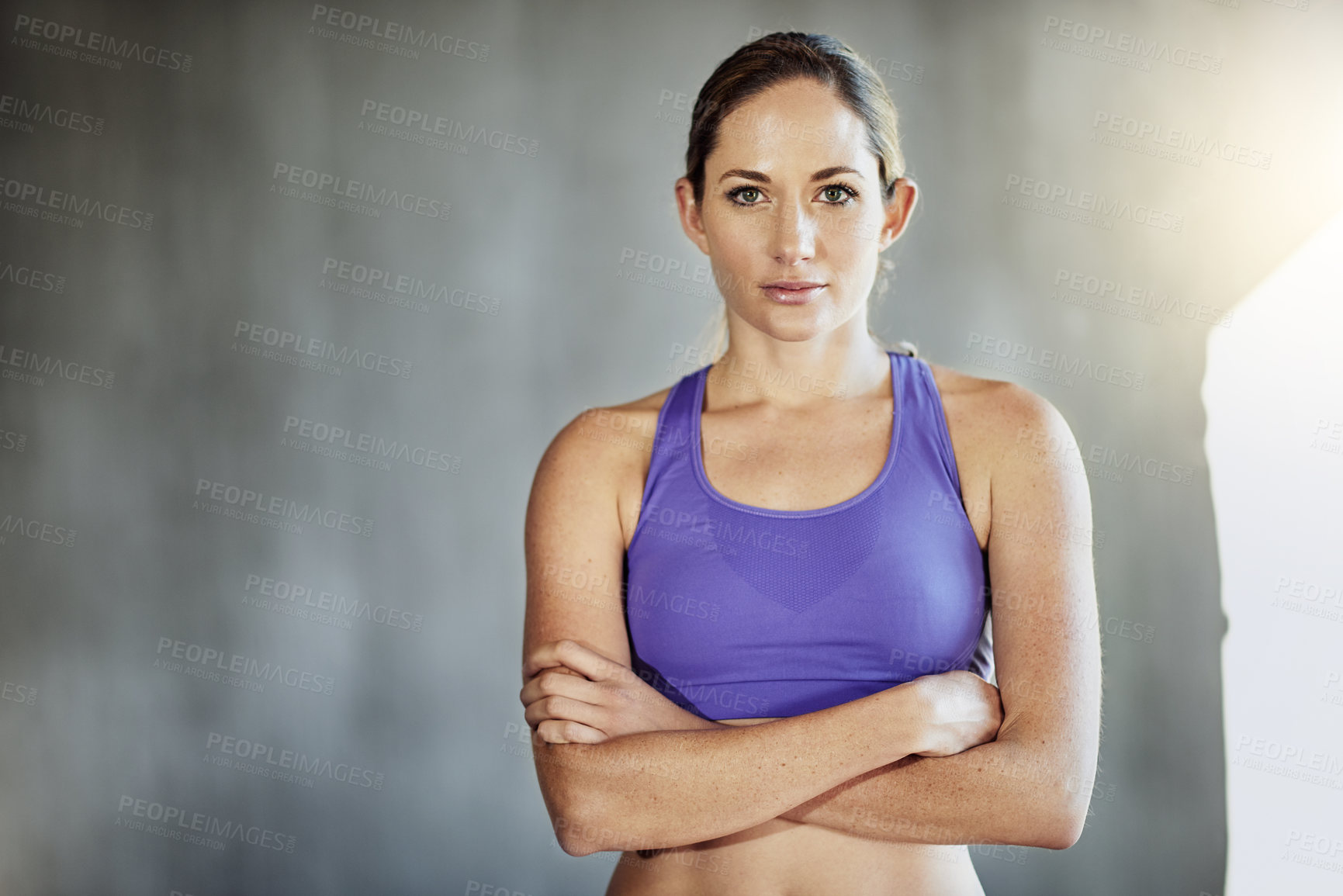 Buy stock photo Serious, fitness and portrait of woman in gym for intense training, exercise and cardio workout. Sports, personal trainer and person with crossed arms for wellness, health and performance with muscle