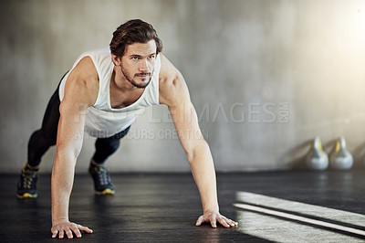 Buy stock photo Health, exercise and man in gym with pushup for strong body, wellness and workout routine for arms. Sports club, plank action and male athlete with discipline for muscle growth and training goals