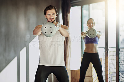 Buy stock photo People, kettlebell and exercise together at gym, weightlifting and equipment for swing workout. Man, woman and coach for athletes in health club, cardio fitness and friends support for challenge