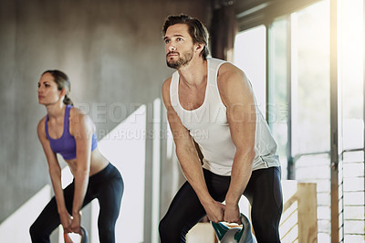 Buy stock photo Exercise, fitness and couple in gym with kettlebell, power and workout challenge together at sports club. Man, woman and personal trainer with weights, muscle development and healthy body training.