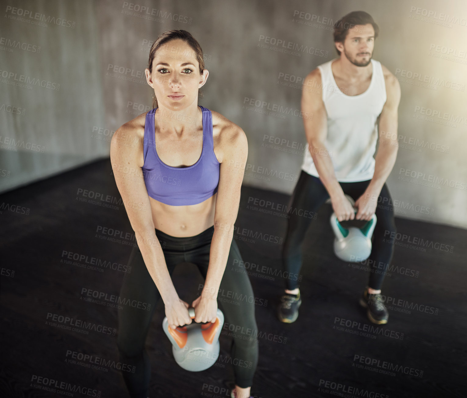 Buy stock photo Man, woman and kettlebell workout for weightlifting routine or muscle building, fitness or exercise. Friends, equipment and athlete training in gym centre for strength development, health or sports