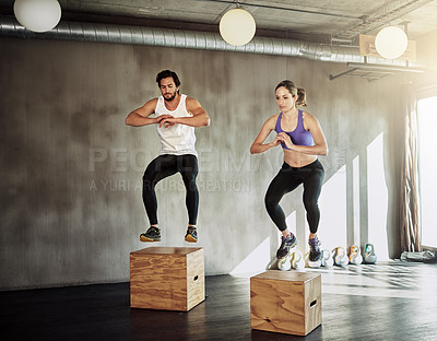 Buy stock photo Jump, workout and couple in gym with box, power and training at fitness challenge together. Man, woman and personal trainer with balance, muscle development and healthy body exercise at sports club