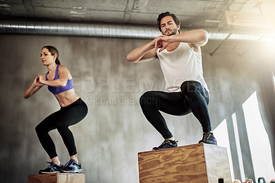 Buy stock photo Jump, fitness and couple in exercise with box, power and training at workout challenge together. Man, woman and personal trainer at gym for balance, muscle development and healthy body at sports club