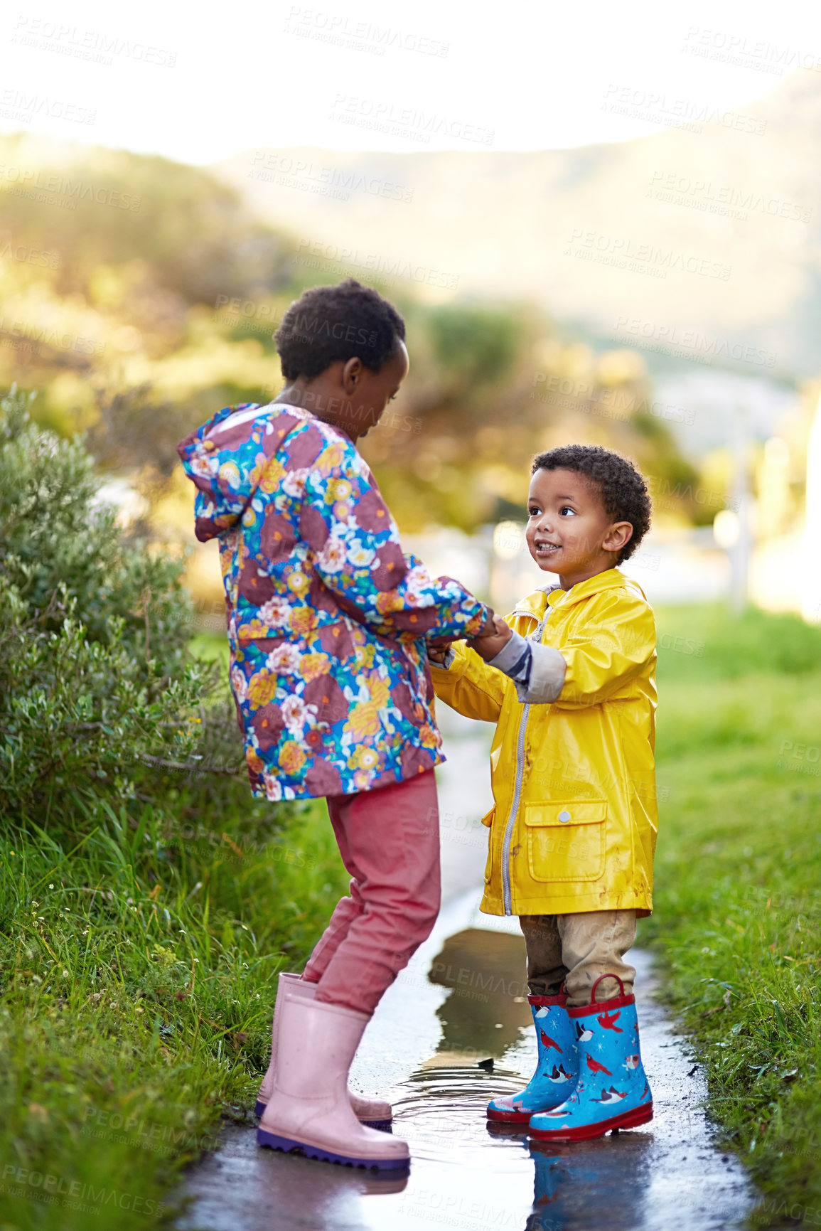 Buy stock photo Nature, happy and children by garden in winter for journey,  support and outdoor adventure together. Raincoat, black kids and siblings with travel in cold weather for bonding, development and holiday