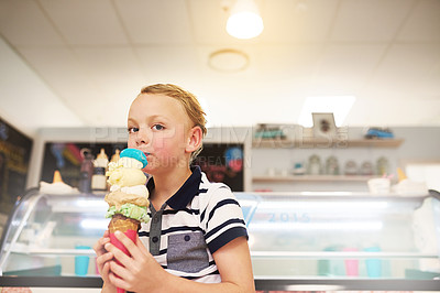 Buy stock photo Ice cream, portrait and child in store for dessert, craving or sweet treat on summer vacation. Happy, cute and boy kid eating scoop of frozen gelato in cone at dairy shop on holiday or weekend trip.