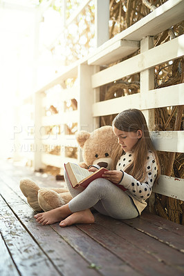 Buy stock photo Outdoor, teddy bear and girl with book for reading, education and language development. Backyard, toys and female child with textbook for storytelling, drawing and entertainment with fantasy