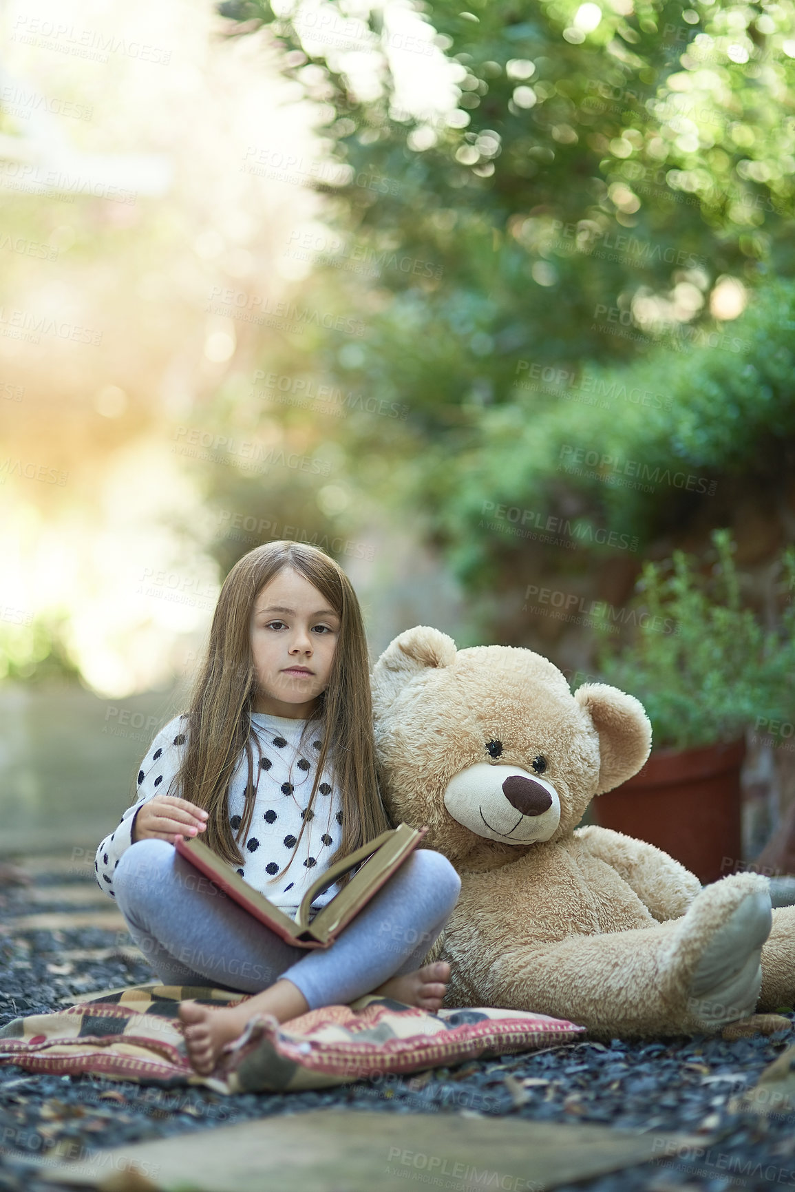 Buy stock photo Backyard, relax and portrait of girl with teddy bear on ground for storytelling, learning and education. Outdoor, garden and kid with story on floor for knowledge, support and child development