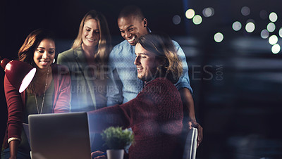 Buy stock photo Shot of a group of colleagues working late in the office together