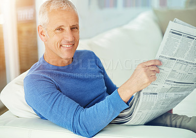 Buy stock photo Senior, man and portrait with newspaper on sofa for article, information and morning routine in living room of home. Elderly, person and face with media story for global news, smile or relax on couch