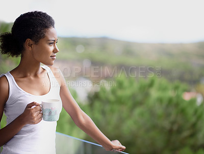 Buy stock photo Black woman, thinking and balcony with coffee in relax for morning, breakfast or natural view of neighborhood. Calm African female person or model in wonder with beverage or drink on terrace at home