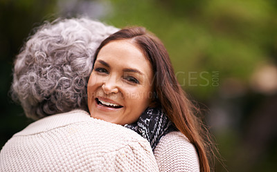 Buy stock photo Hug, mother and woman with smile for love, embrace and affection for bonding with happiness. Family, elderly female person and daughter with mom together in garden, backyard and outdoor in nature