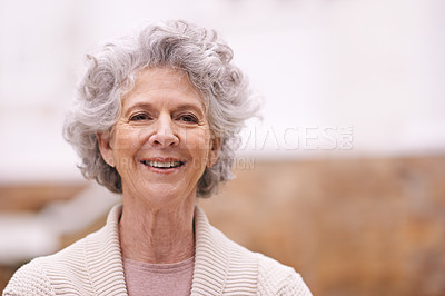 Buy stock photo Portrait of a smiling senior woman standing outside