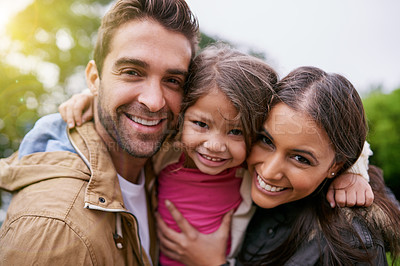 Buy stock photo Family, closeup and park hug portrait with a mom, dad and girl together with happiness and smile. Outdoor, face and vacation of mother, father and kid with bonding, love and child care in nature