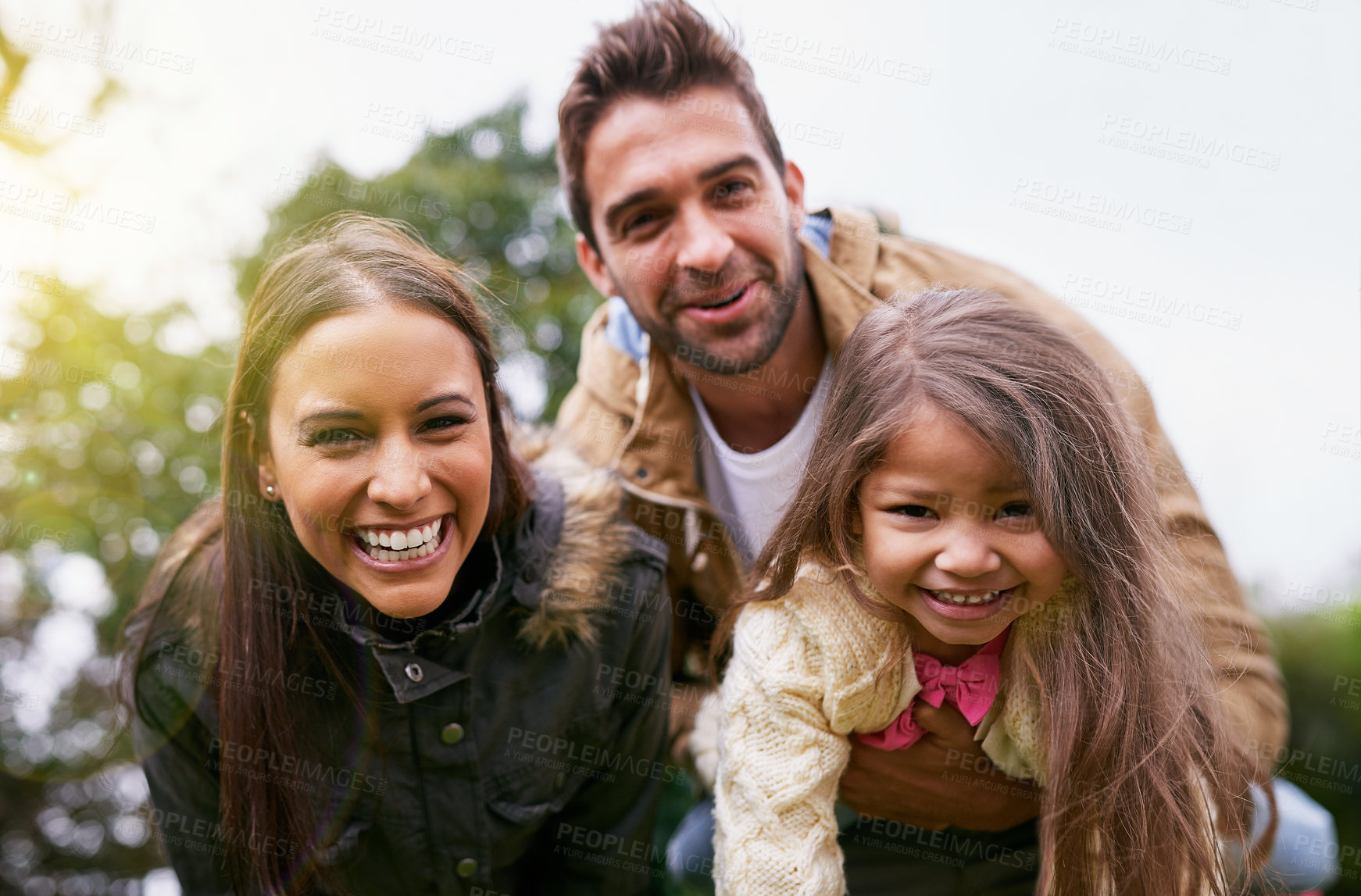 Buy stock photo Family, laughing and park with face of parents, dad and girl together with mom and smile. Outdoor, portrait and vacation of a mother, father and kid with bonding, parent love and young child care