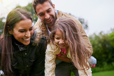 Buy stock photo Mom, dad and child laughing in park with love, bonding and support at outdoor family adventure. Smile, parents and girl on playful walk in garden together with happy man, woman and kid in nature