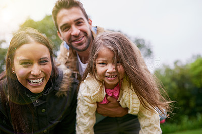 Buy stock photo Smile, parents and child in portrait in park with love, bonding and support at outdoor family adventure. Mom, dad and girl on playful walk in garden together with happy man, woman and kid in nature