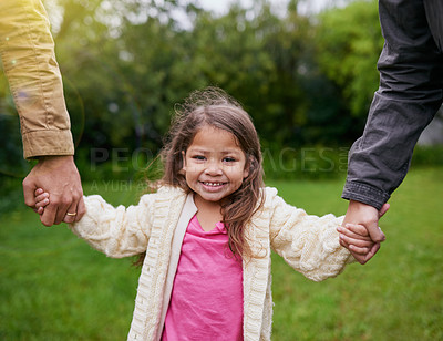 Buy stock photo Portrait, parents and kid holding hands in park with smile, support and trust on outdoor adventure. Love, fun and face of girl with family in garden for happy holiday, nature or walking in backyard