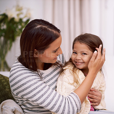 Buy stock photo Lounge, mother and daughter with smile for portrait with embrace of love, care and happiness. Apartment, mom and girl in living room to relax on sofa or couch with hug for bonding in family house