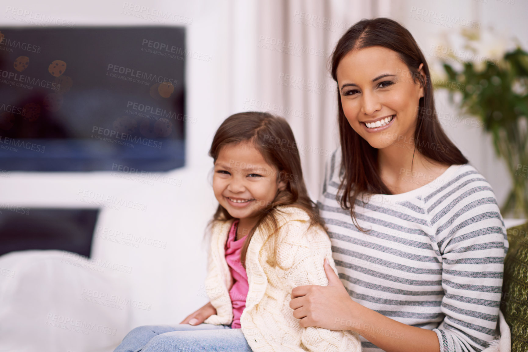 Buy stock photo Portrait, mom and girl with smile in living room, embrace and home with love, care and happiness. Apartment, mother and kid in lounge to relax on sofa or couch with hug for bonding in family house