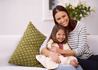 Buy stock photo Lounge, mom and daughter with hug for bonding in home with smile, care and happiness. Apartment, woman and girl  together in living room to relax on couch or sofa for mother's day in weekend