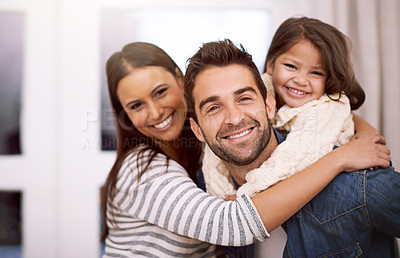 Buy stock photo Mom, dad and kid in home for portrait with love or care, quality time and family bonding for memories or connection. Parents, girl and together for comfort or safety on weekend, hug and happiness.