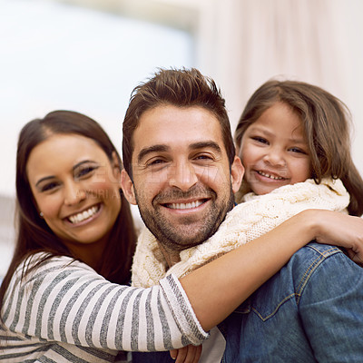 Buy stock photo Mom, dad and kid in home for portrait with love or care, quality time and family bonding for memories or connection. Parents, girl child and together for comfort or safety on weekend, hug and closeup