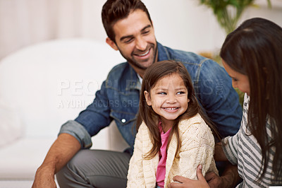 Buy stock photo Happy, sofa and family in living room with support, bonding and childhood development at home. Smile, woman and man with little girl for holiday enjoyment, satisfaction and relaxing on couch in house