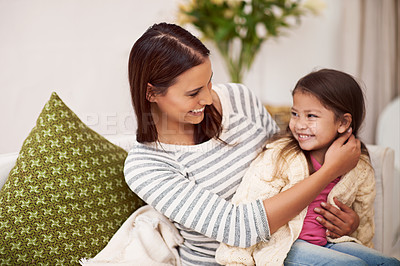 Buy stock photo Lounge, mother and daughter with smile for embrace in home with love, care and happiness. Apartment, mom and girl in living room to relax on sofa or couch with hug for bonding in family house