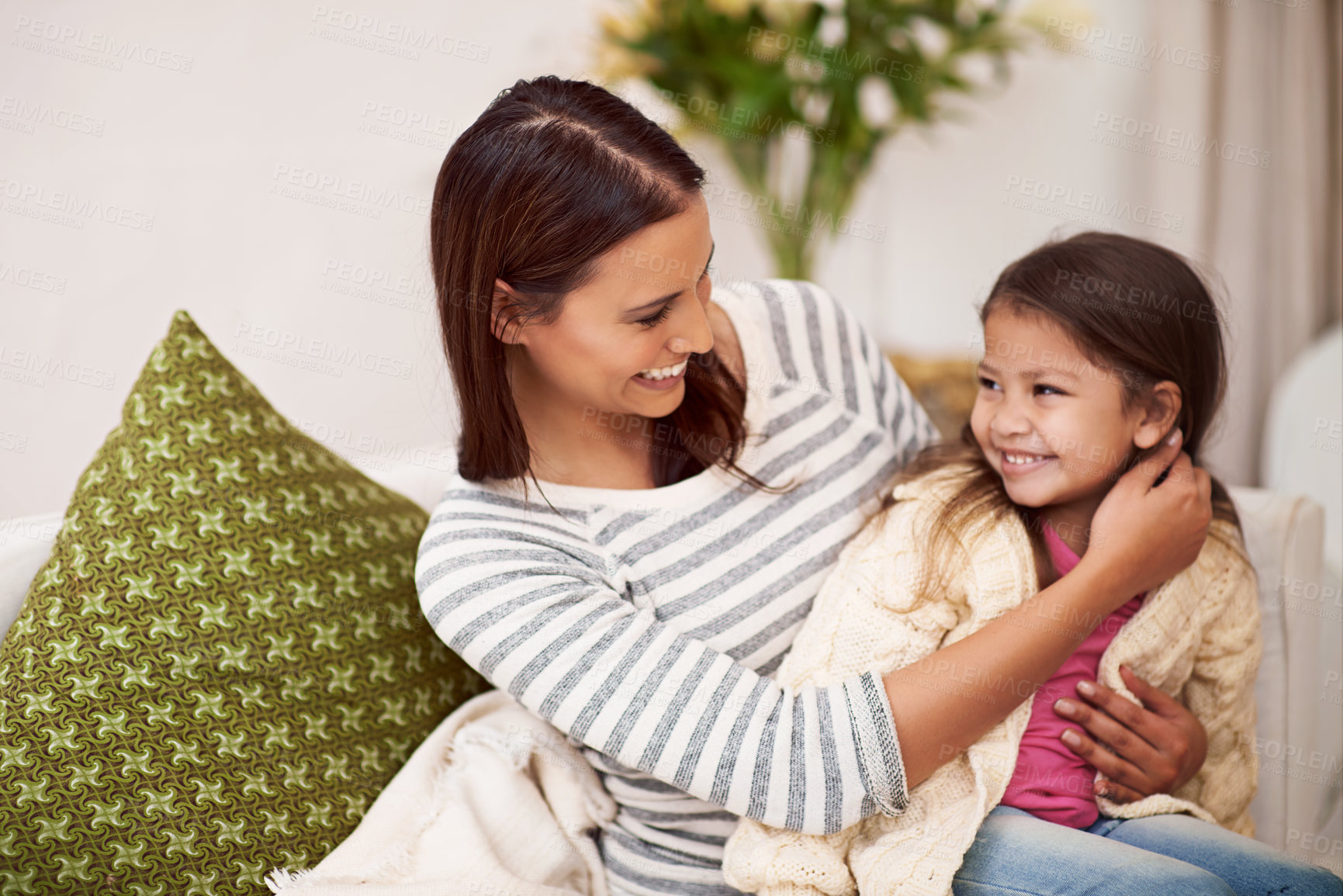 Buy stock photo Lounge, mother and daughter with smile for embrace in home with love, care and happiness. Apartment, mom and girl in living room to relax on sofa or couch with hug for bonding in family house