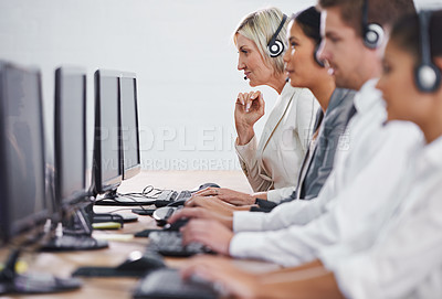 Buy stock photo Help desk, phone call and row of women, men and typing on computer at customer support. Headset, telemarketing and client service agent at callcenter for online consultation, team and business people