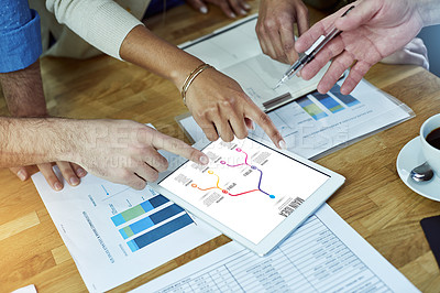 Buy stock photo Cropped shot of coworkers discussing statistics