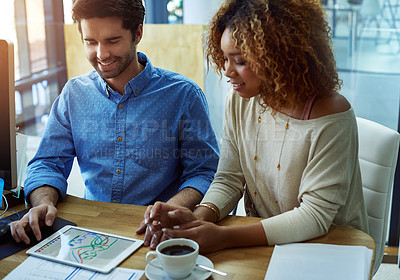 Buy stock photo Shot of coworkers discussing something on a digital tablet
