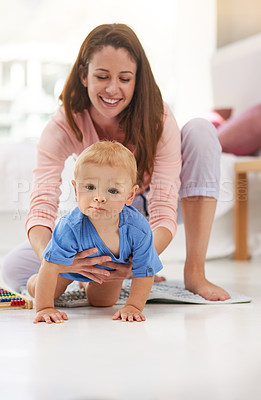 Buy stock photo Mom, toddler and happy with crawling for childcare to support, love and growth for child development. Parent, baby and smile in home with playing for bonding, childhood memories and fun with care