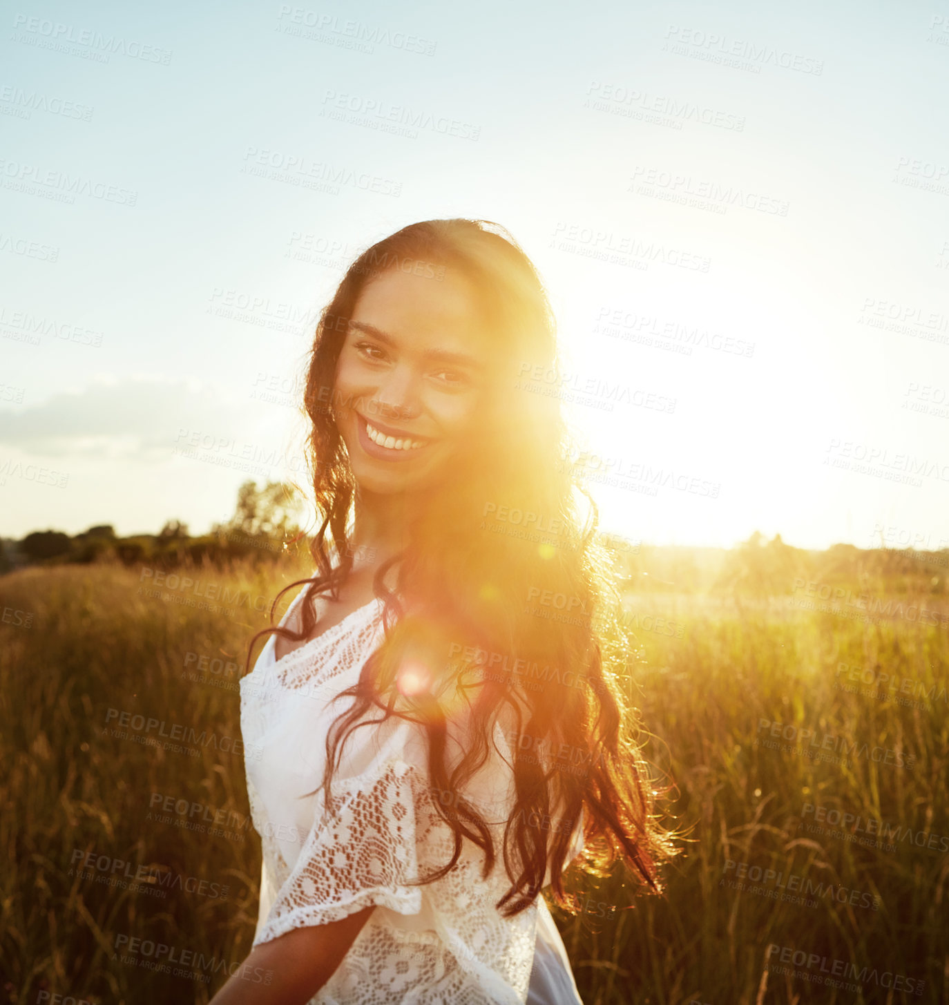 Buy stock photo Sunshine, happy and portrait of woman in field for fresh air, holiday and adventure in morning. Nature, flare and person in countryside for tourism, travel and relax outdoor for peace, calm and smile