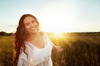 Buy stock photo Portrait of an attractive young woman standing outside in a field