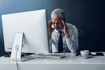 Buy stock photo Mental health, mature businessman with headache and against a studio background at his desk. Burnout or migraine pain, mistake or problem and male person stress for bankruptcy or overworked.