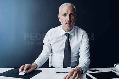 Buy stock photo Cropped portrait of a mature businessman working on his computer