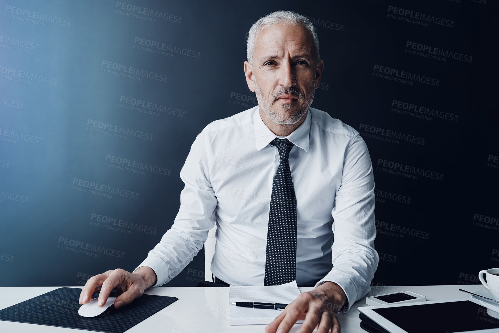 Buy stock photo Cropped portrait of a mature businessman working on his computer