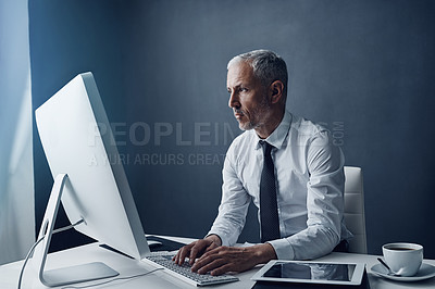 Buy stock photo Computer, typing accountant and senior man in office, working on project online or mockup. Desktop, writing and serious manager at desk for reading email, research information or business auditor.