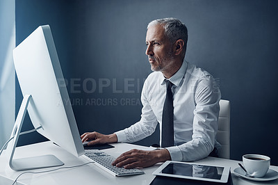 Buy stock photo Typing auditor, computer and elderly man in studio, working and isolated on a dark background mockup. Focus, writing or serious executive at desktop for reading email, research or business accountant