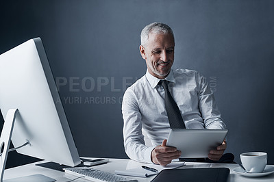 Buy stock photo Tablet, accountant and elderly business man in studio isolated on a dark background mockup space. Technology, happy and manager at desk, executive or auditor working on research, email or reading app