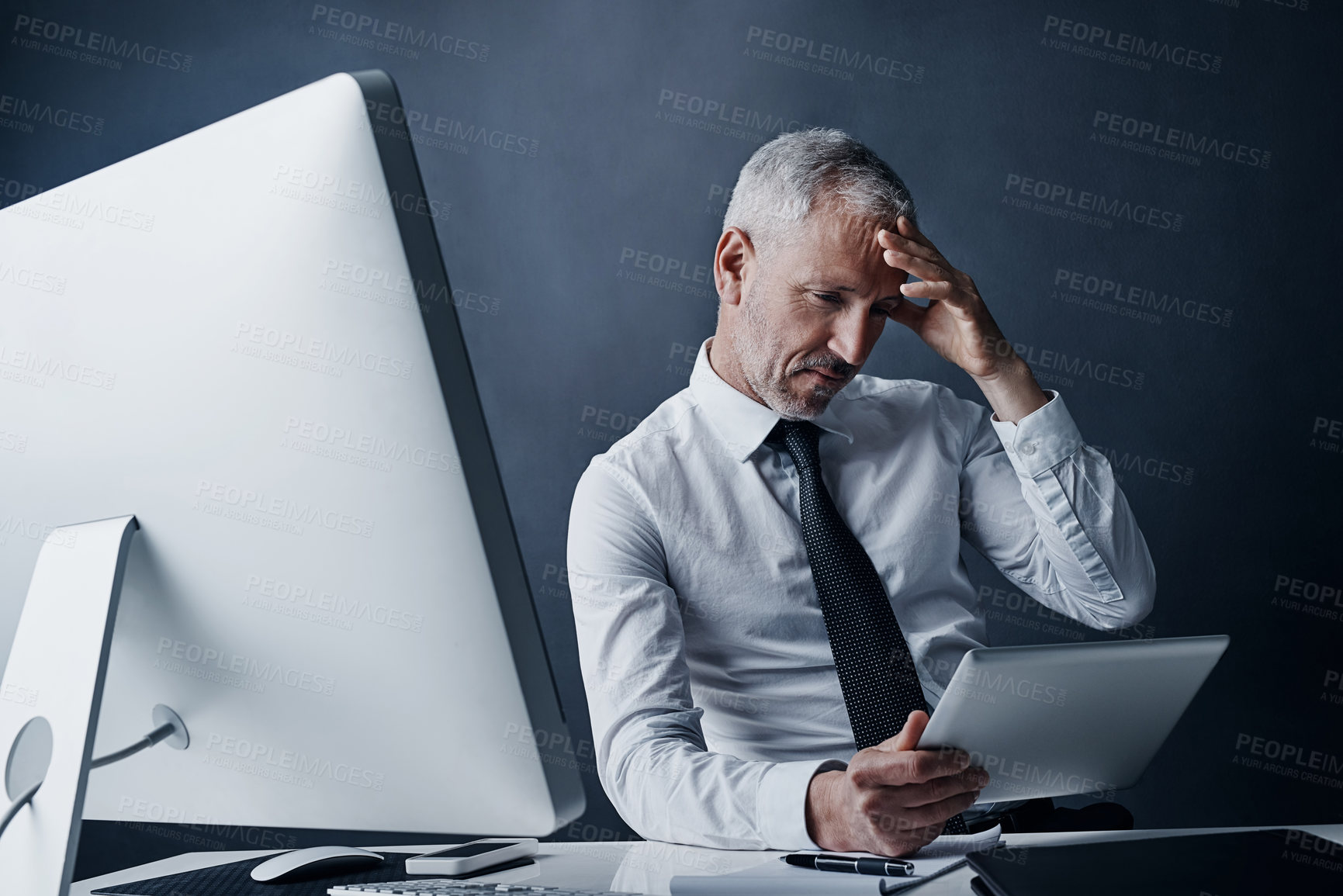 Buy stock photo Tablet, crisis and senior business man in studio isolated on a dark background. Technology, mistake and elderly manager at desk reading email, tax or problem for bankruptcy, debt or fail challenge.